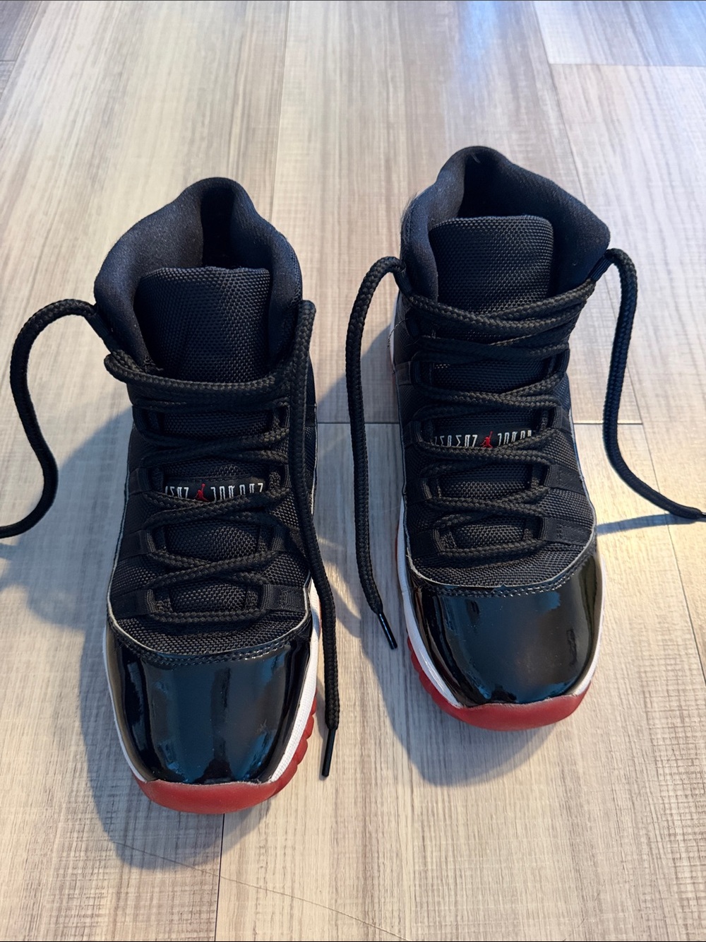 Jordan Kids Black and Red High Top Sneakers with Patent Toe